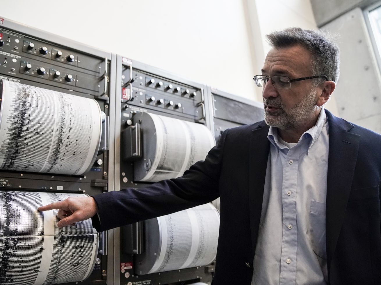 Keith Koper, director of University of Utah Seismograph
Stations, shows an earthquake pattern from a seismometer in Salt
Lake City on Friday.
