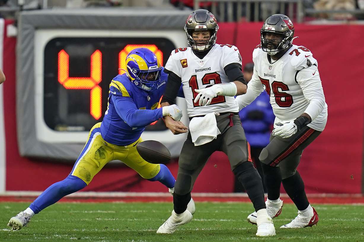 Los Angeles Rams outside linebacker Von Miller (40) strips the ball from Tampa Bay Buccaneers quarterback Tom Brady (12) during the second half of an NFL divisional round playoff football game Sunday, Jan. 23, 2022, in Tampa, Fla.
