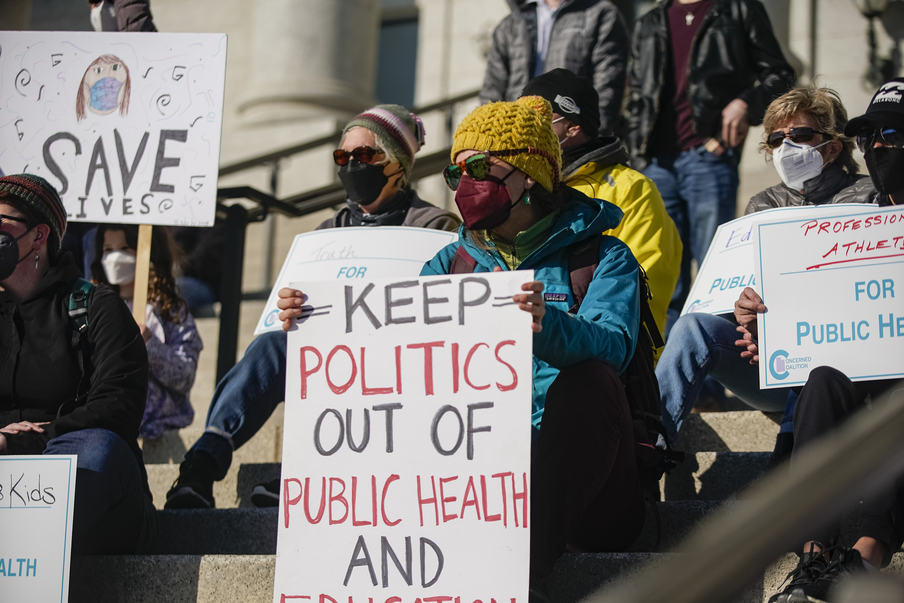 People join the Concerned Coalition Public Health Rally in demand to remove partisan politics from Utah’s public health policies at the state Capitol in Salt Lake City on Saturday.