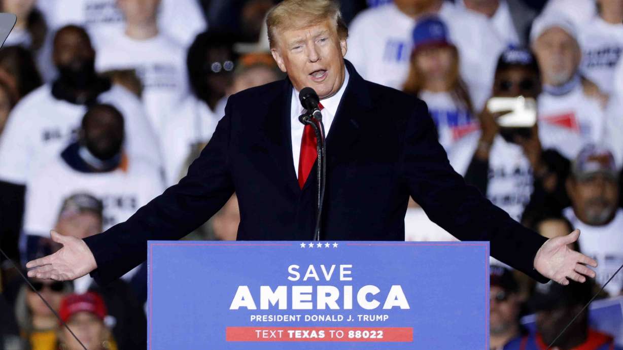 Former President Donald Trump speaks at a rally Saturday in Conroe, Texas, and said if he is elected again he may pardon participants in the storming of the U.S. Capitol "because they are being treated so unfairly."