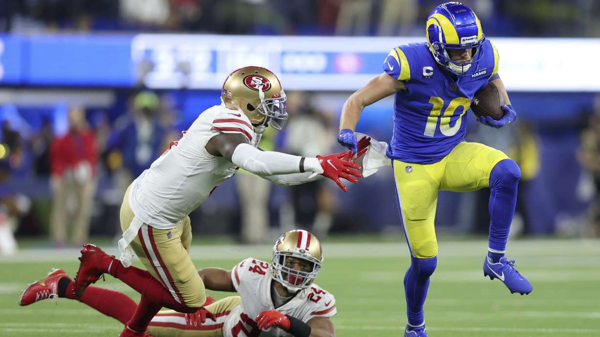 Los Angeles Rams' Cooper Kupp (10) gets past San Francisco 49ers' Jaquiski Tartt, left, and K'Waun Williams (24) during the second half of the NFC Championship NFL football game Sunday, Jan. 30, 2022, in Inglewood, Calif.