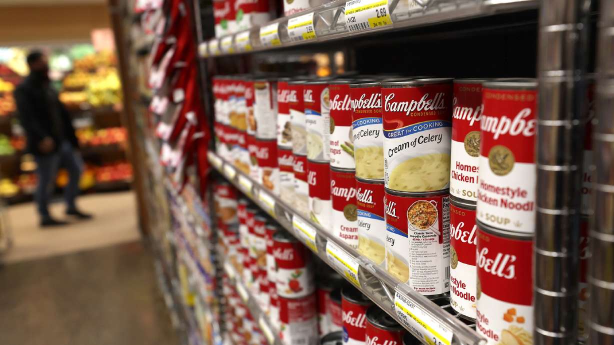 Grocery prices keep going up. Cans of Campbell's Soup are displayed on a shelf at Scotty's Market on December 08, 2021, in San Rafael, California.