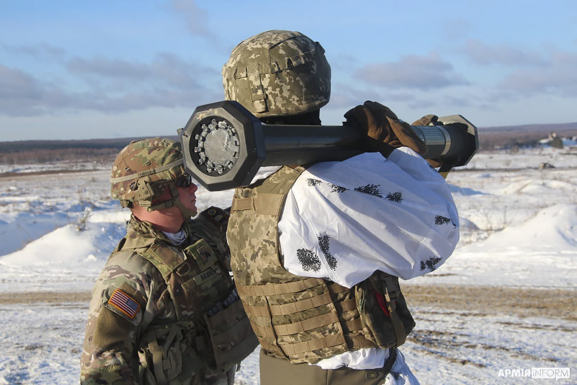 In this photo provided by the Ukrainian Defense Press Service taken on Sunday, a US instructor trains Ukrainian soldier for the use of M141 Bunker Defeat Munition missiles at the Yavoriv military training ground, close to Lviv, western Ukraine.