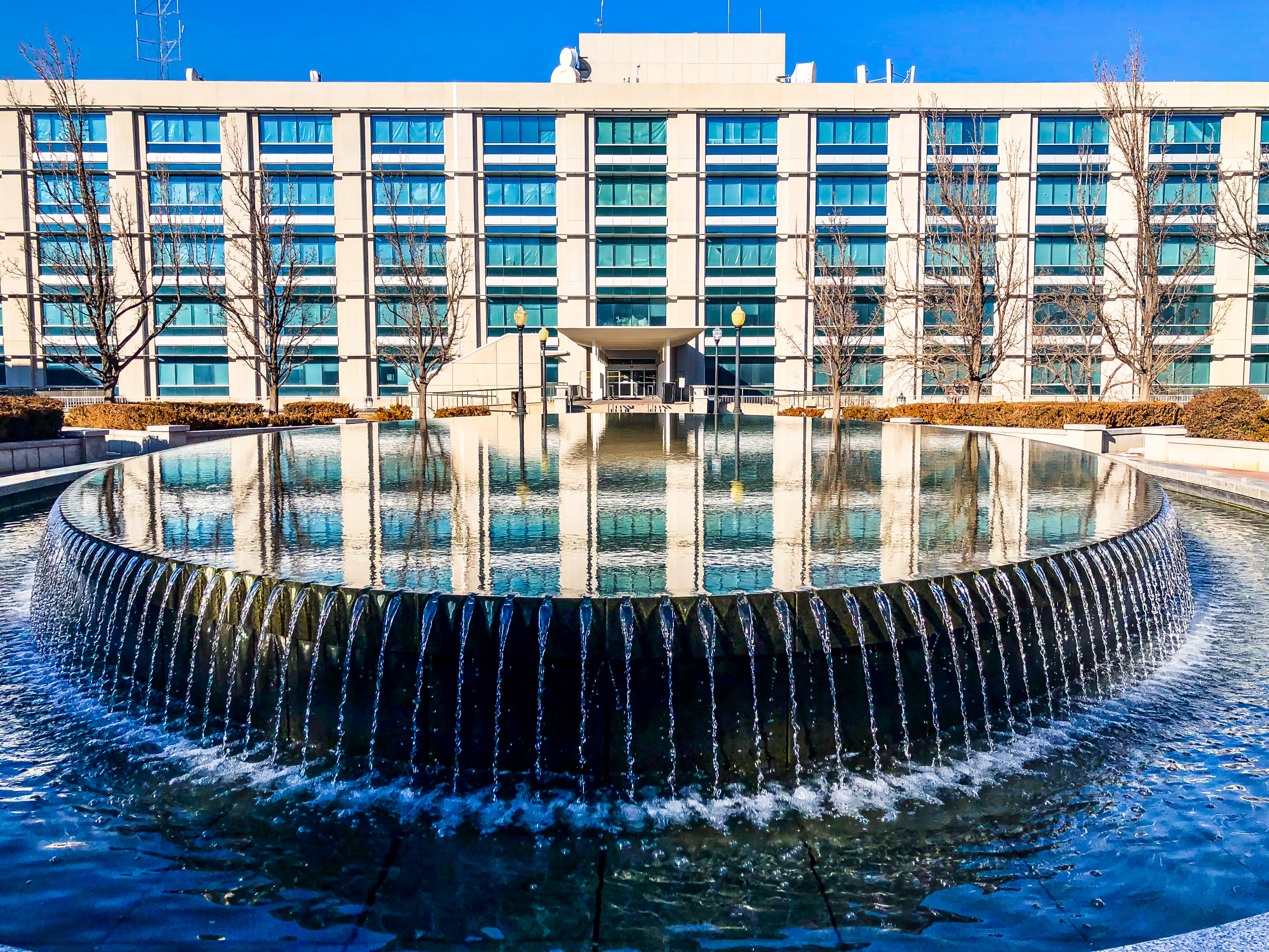 The exterior of the State Office Building reflects on a reflecting pool at the Utah Capitol grounds on Friday. The building is slated to be demolished later this year to make way for a new state museum and office building.