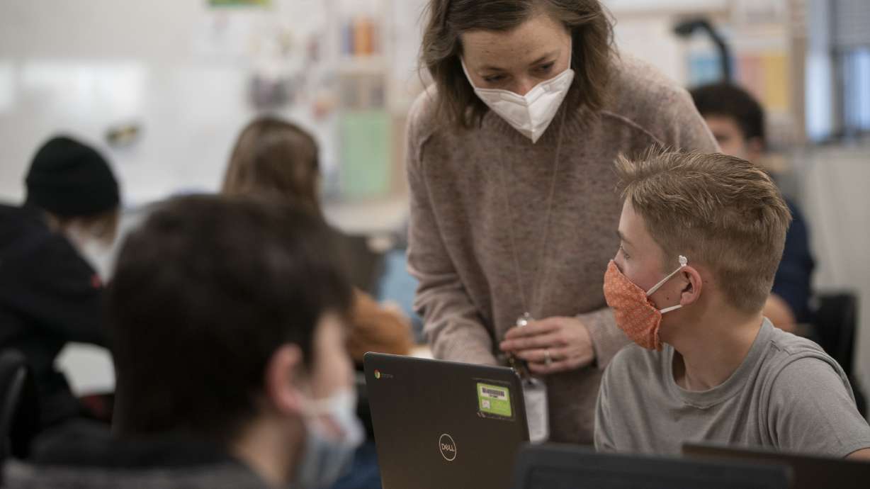 Eighth-grade students and their teacher wear masks during their dual-language class at Mount Jordan Middle School in Sandy on Monday, Jan. 10. Utah teachers are speaking out about the frustrations and burnout they're experiencing due to teaching through a global pandemic.