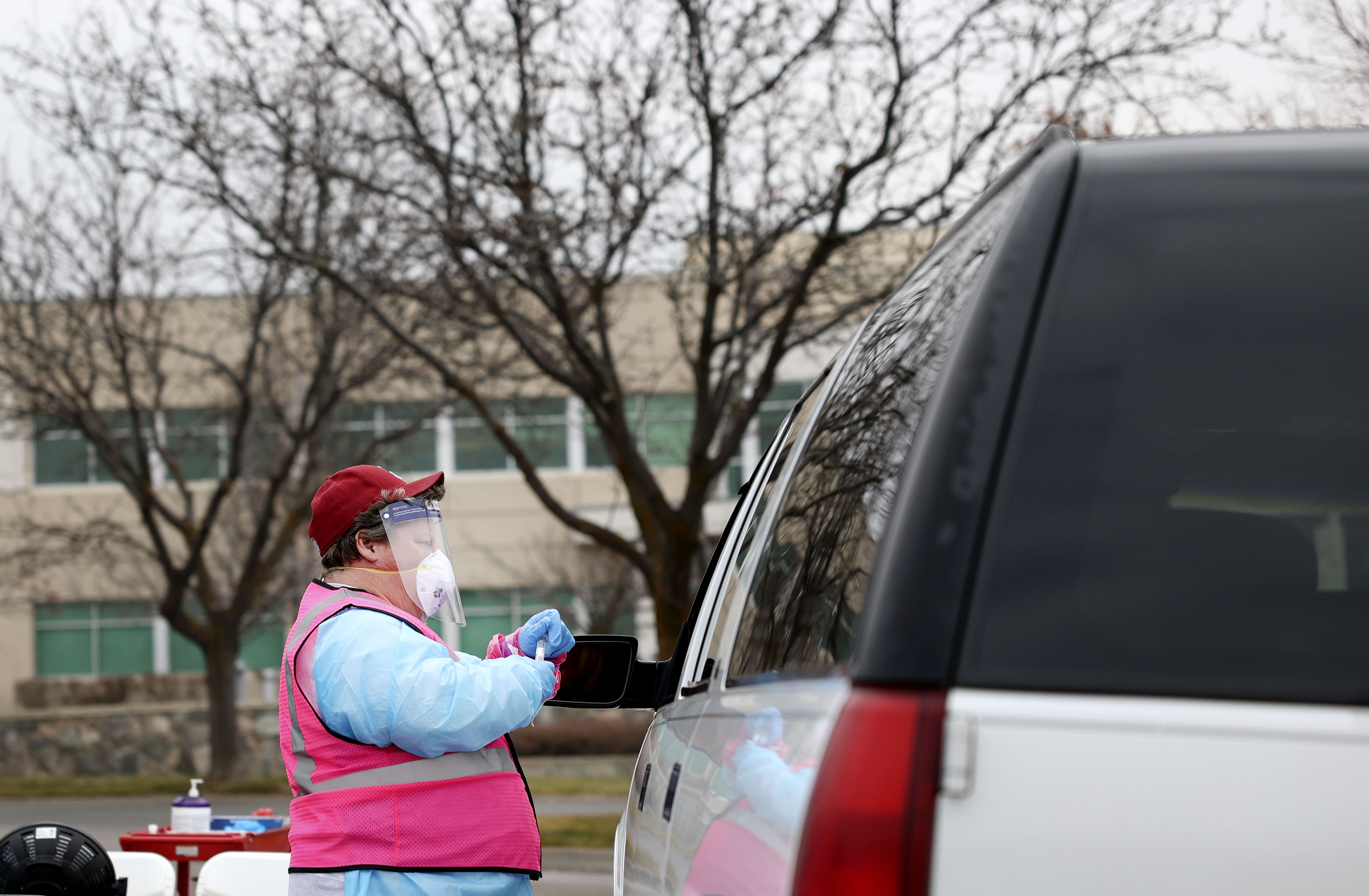 Mike Tanner works at a COVID-19 testing site in Bountiful on Jan. 19. Utah health officials on Monday reported 10,272 new COVID-19 cases since Friday, as well as 11 additional deaths.
