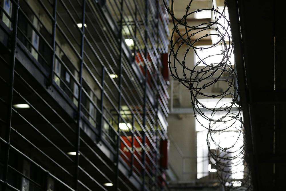 Barbed wire is seen inside the east block of death row at San Quentin State Prison Tuesday, Aug. 16, 2016.