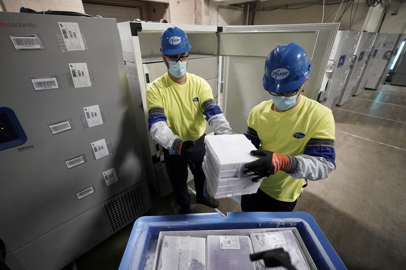 Boxes containing the Pfizer-BioNTech COVID-19 vaccine are prepared to be shipped at the Pfizer Global Supply Kalamazoo manufacturing plant in Portage, Michigan, on Dec. 13, 2020.
