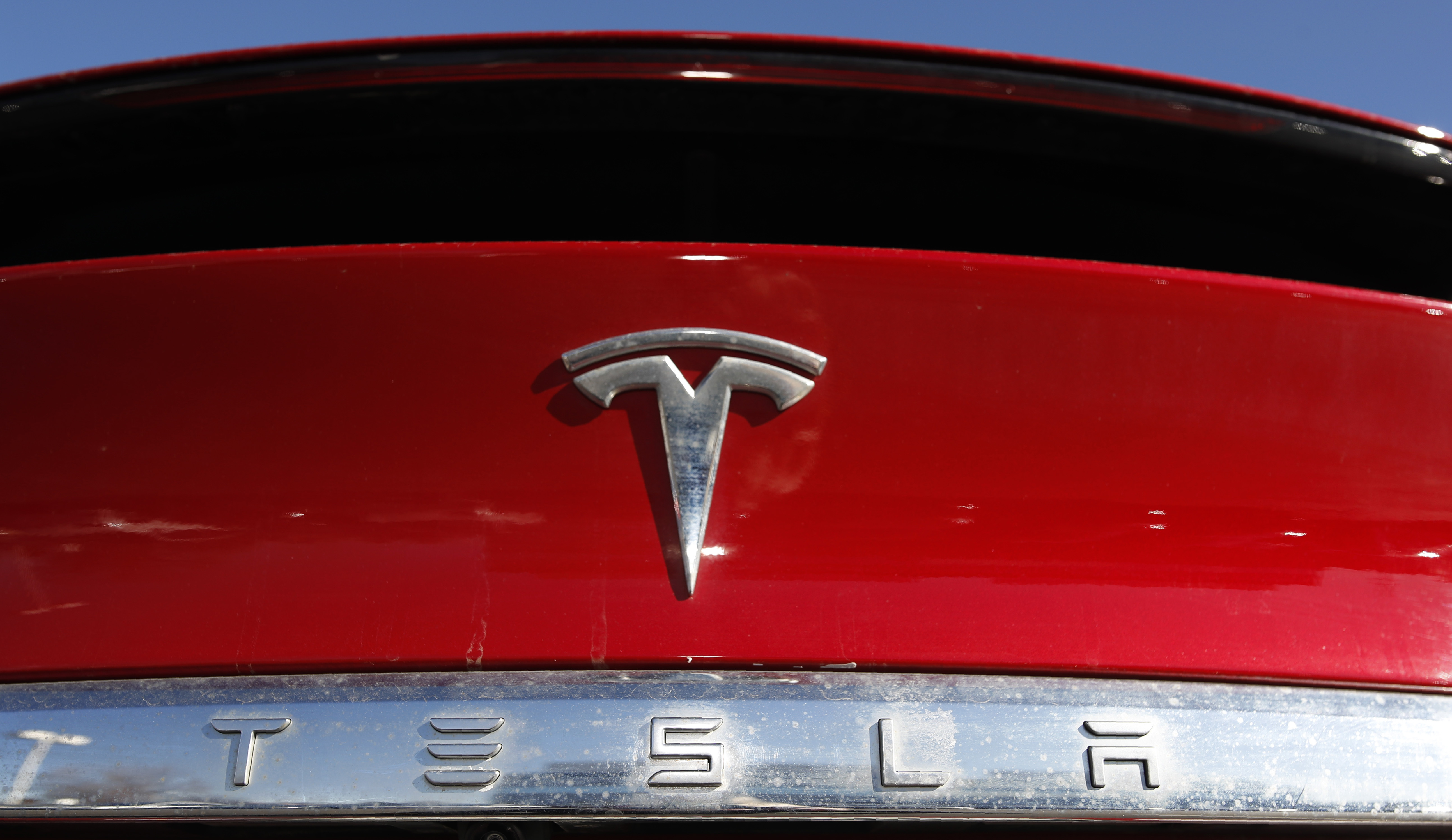 The company logo sits on an unsold 2020 Model X at a Tesla dealership in Littleton, Colo. Tesla Inc. on Wednesday.