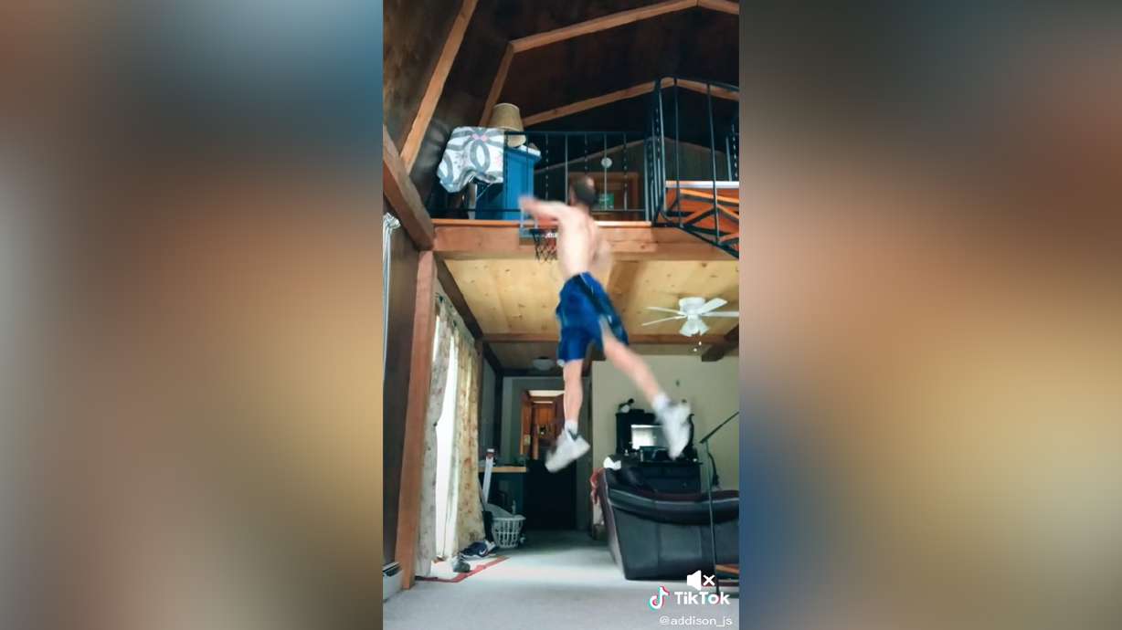 Addison Stewart goes up for a slam dunk in his mini hoop. Mini hoop or no, these are awesome dunks.