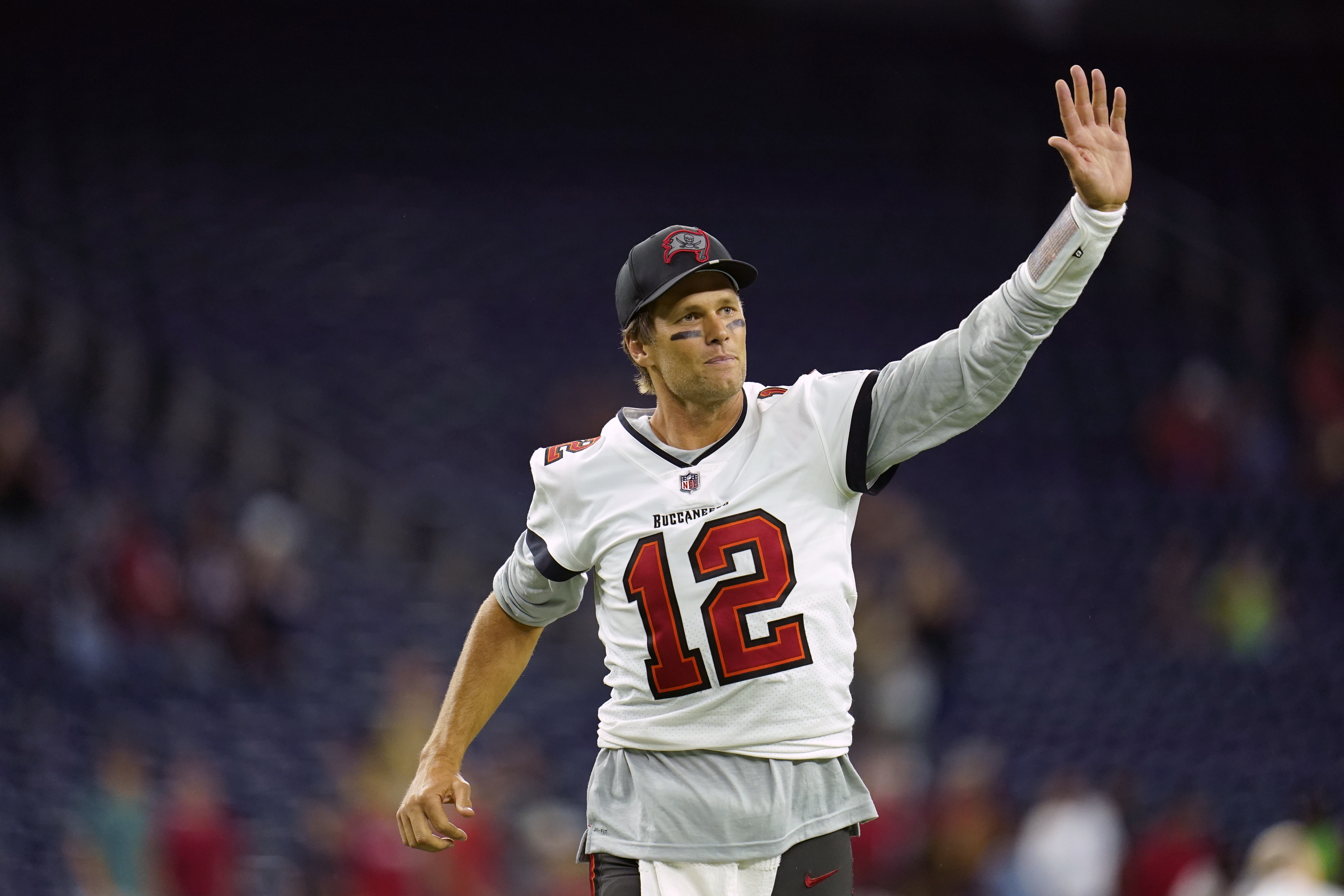 Tampa Bay Buccaneers quarterback Tom Brady (12) waves toward the fans as he leaves the field after an NFL preseason football game against the Houston Texans, Saturday, Aug. 28, 2021, in Houston.