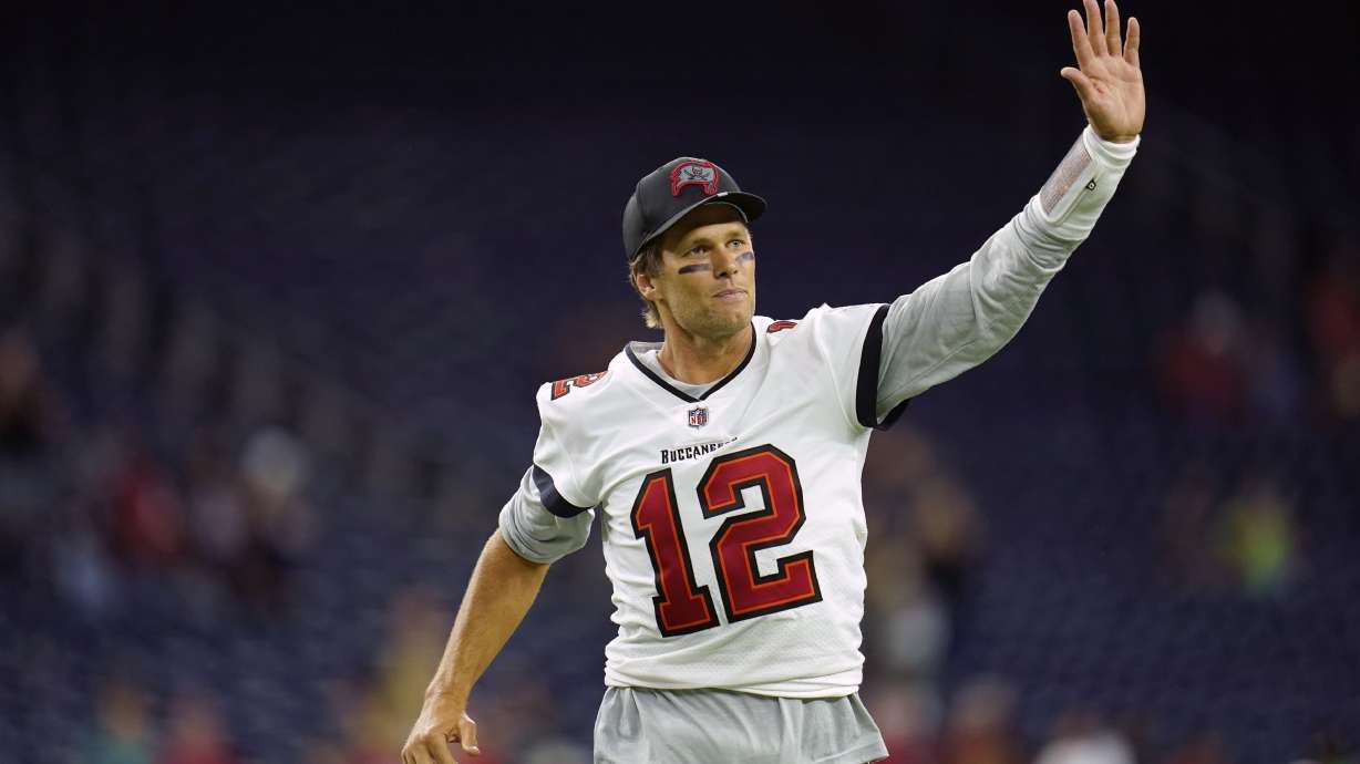 Tampa Bay Buccaneers quarterback Tom Brady (12) waves toward the fans as he leaves the field after an NFL preseason football game against the Houston Texans, Saturday, Aug. 28, 2021, in Houston.