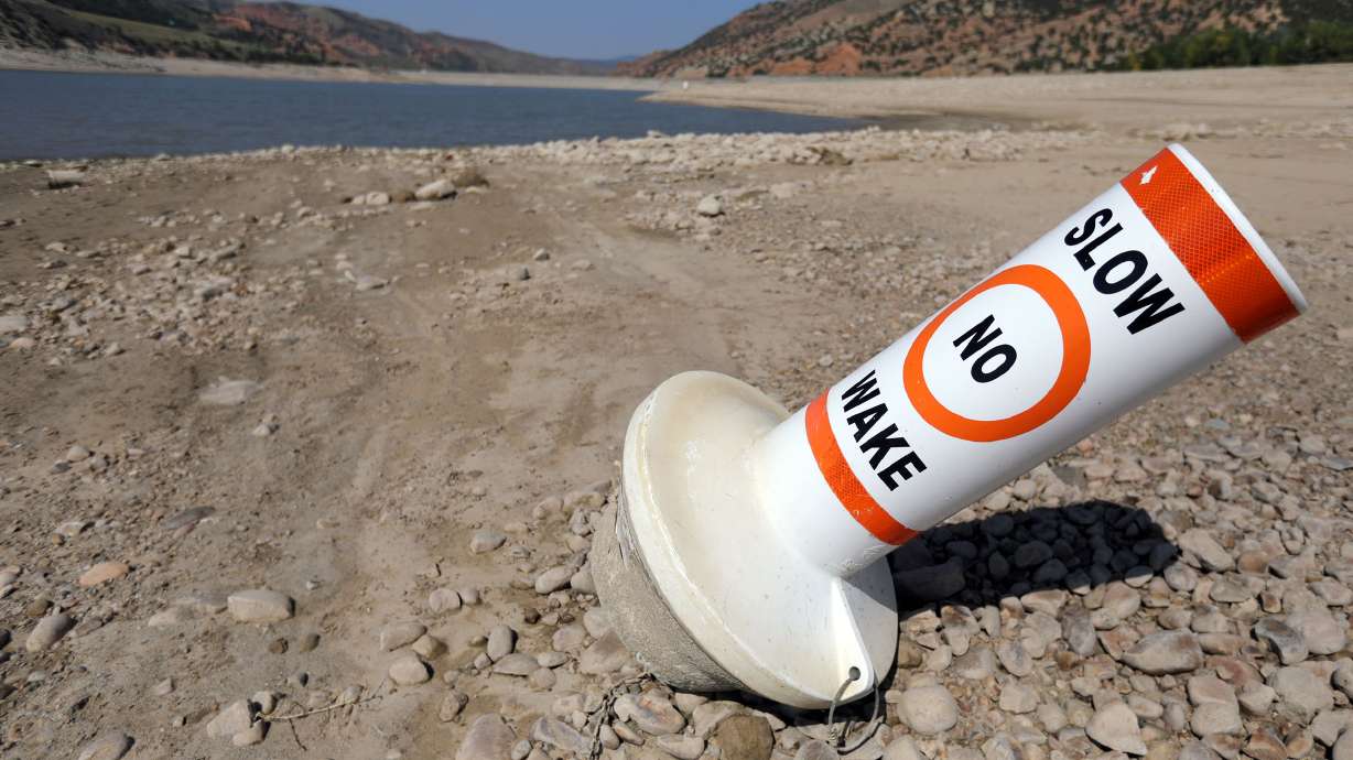 A marker buoy is grounded on the dried-up shore of Echo Reservoir at Echo State Park during a drought on Sept. 16, 2021. A new report led by Utah State University suggests the West's drought appears to be the result of fewer storms and less about patterns that block storms from arriving in the West.