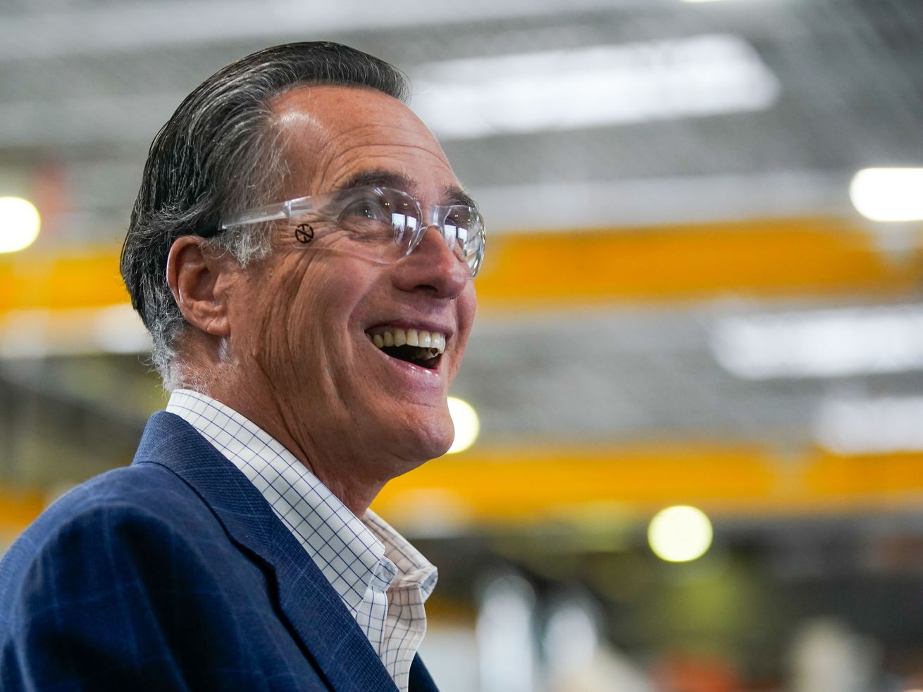 Sen. Mitt Romney, R-Utah, laughs as he tours Kenworth Sales in West Valley City on Nov. 12, 2021. A new Deseret
News/Hinckley Institute of Politics poll shows 51% of Republicans and 51% of Democrats in the state approve of his job performance. Romney does even a little better among unaffiliated voters with a 54% approval rating.