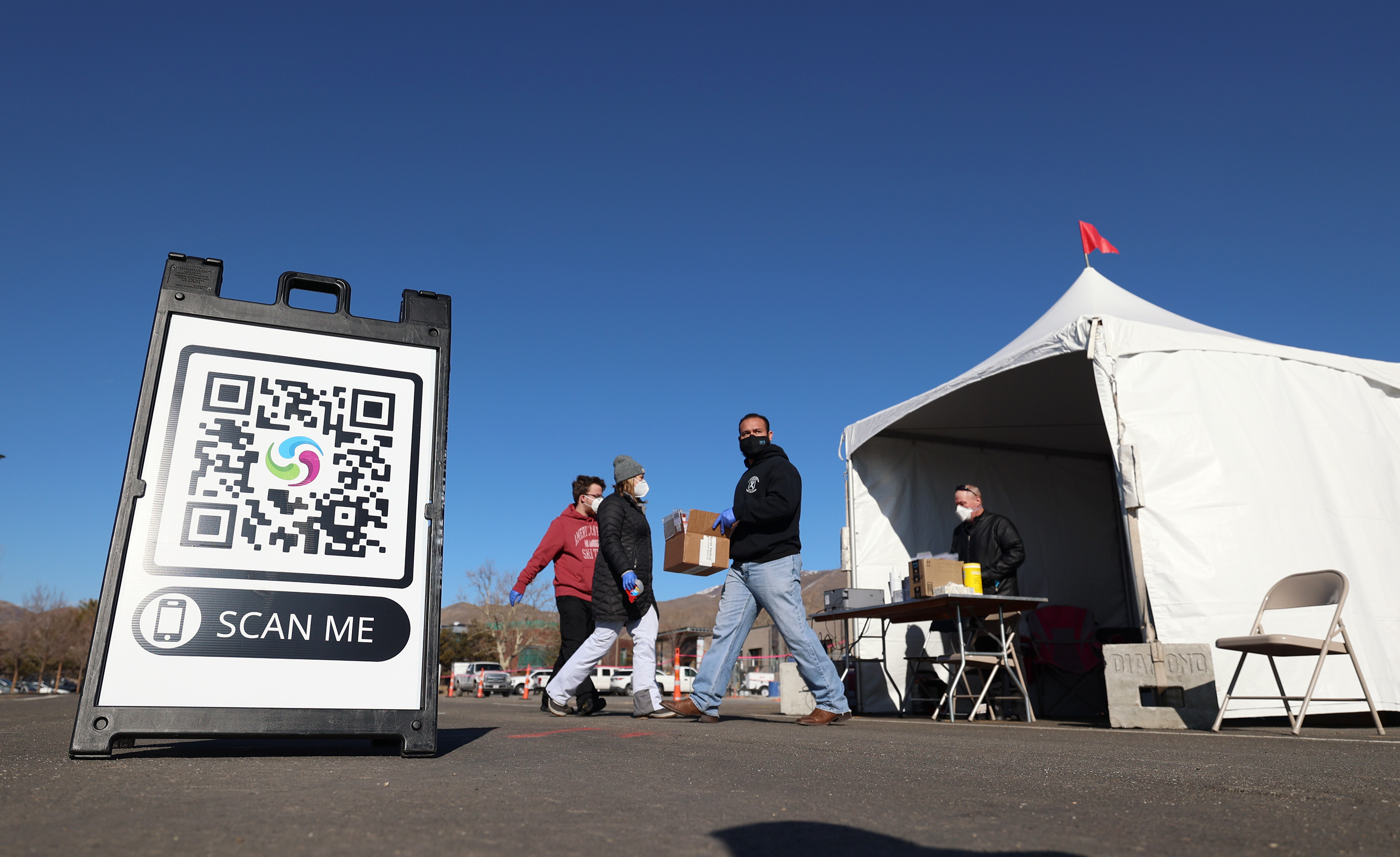 People receive COVID-19 tests at the University of Utah in Salt Lake City on Jan. 31. Health officials reported 20 more COVID-19 deaths and 614 new cases on Wednesday.