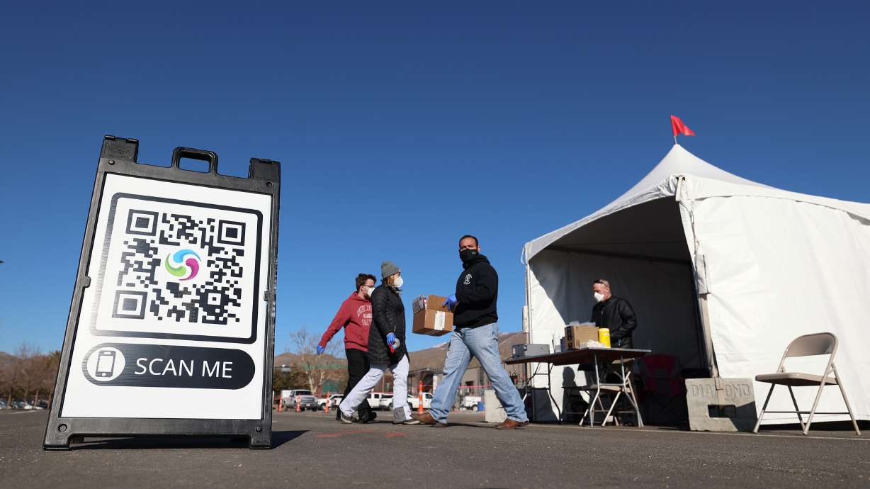 People receive COVID-19 tests at the University of Utah in Salt Lake City on Monday. Utah health officials reported 3,482 new COVID-19 cases and 10 deaths on Thursday.