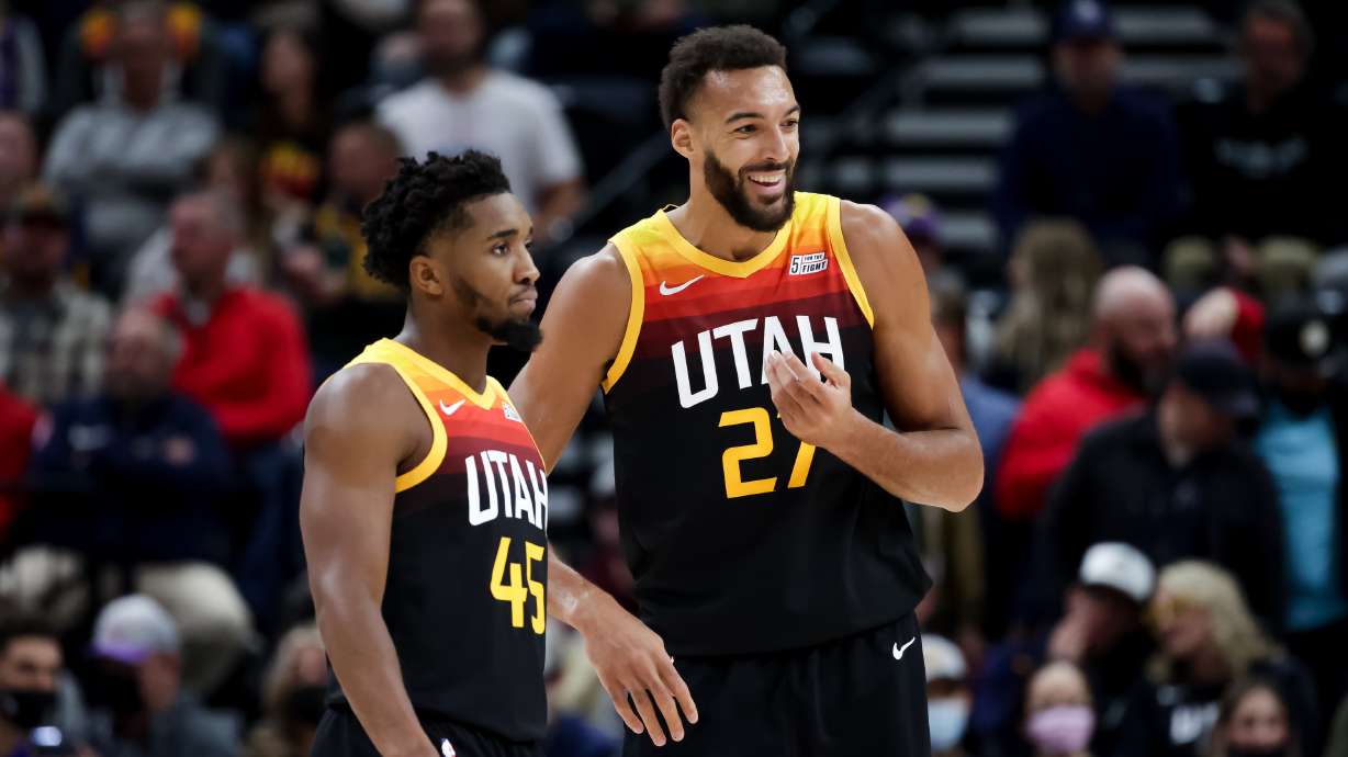 Utah Jazz guard Donovan Mitchell (45) and center Rudy Gobert (27) talk on the court during the game against the Philadelphia 76ers at Vivint Arena in Salt Lake City on Tuesday, Nov. 16, 2021.