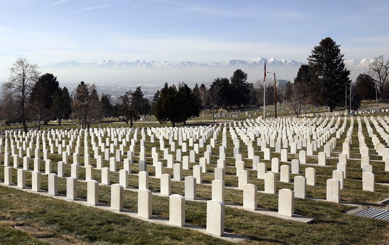 Smog settles over the Salt Lake Valley during an
inversion as seen from the Salt Lake City Cemetery in Salt Lake
City on Wednesday, Jan. 12. HB109, sponsored by Rep. Steve
Handy, R-Layton, would allow physicians to indicate that poor air
quality contributed to an individual’s death on the death
certificate.