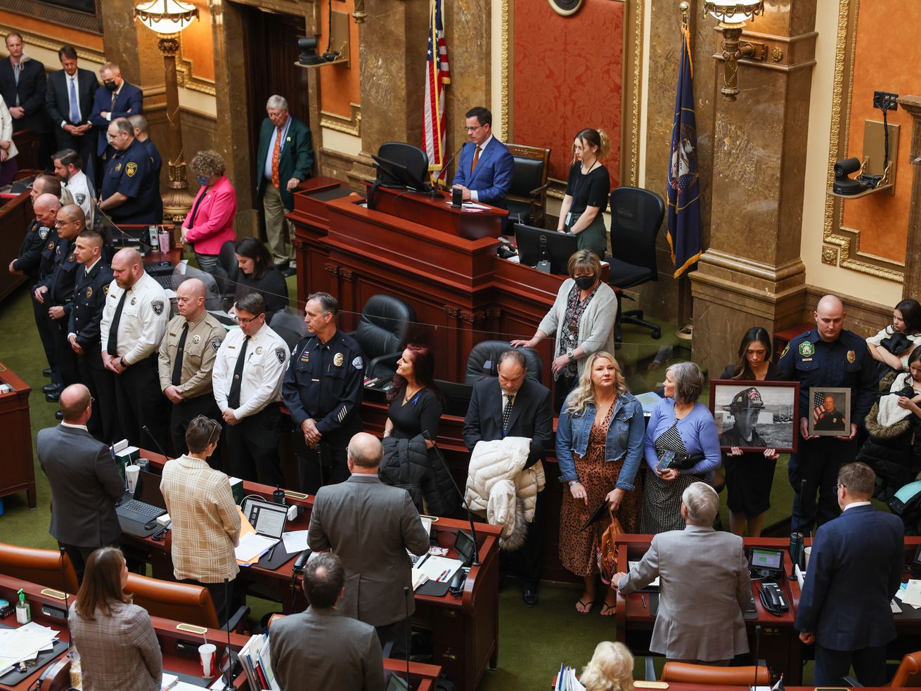 Family members of fallen first responders are honored on the floor of the House chamber during the 2022 Utah legislative session at the Capitol in Salt Lake City on Thursday.