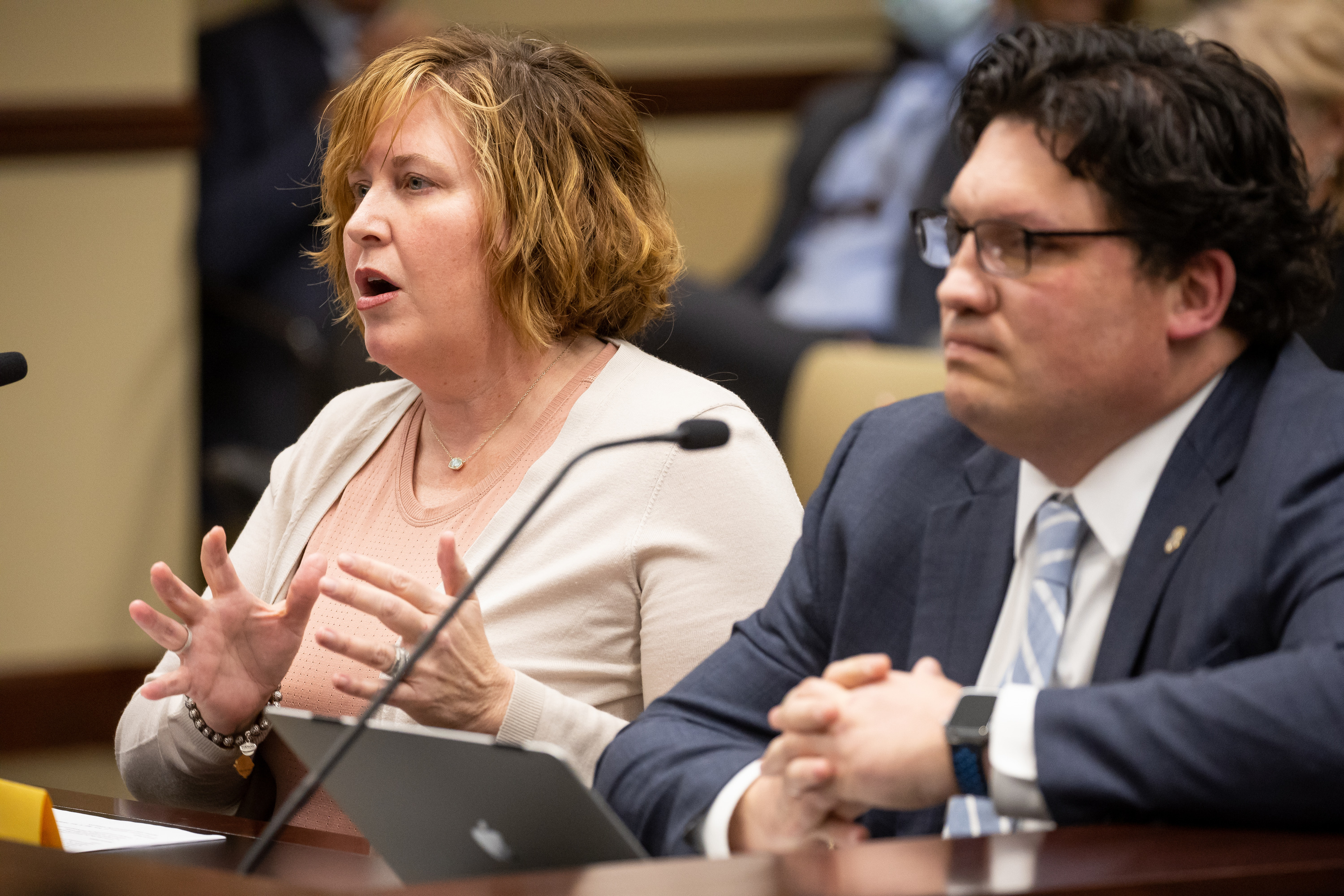 Pamela Vickery, executive director of Utah Juvenile Defender Attorneys, speaks in favor of HB171 next to the bill’s sponsor, Rep. Ryan Wilcox, R-Ogden, in a meeting of the House Law Enforcement and Criminal Justice Committee at the Capitol in Salt Lake City on Thursday. The bill would prohibit the use of deceptive interrogation techniques against minors.