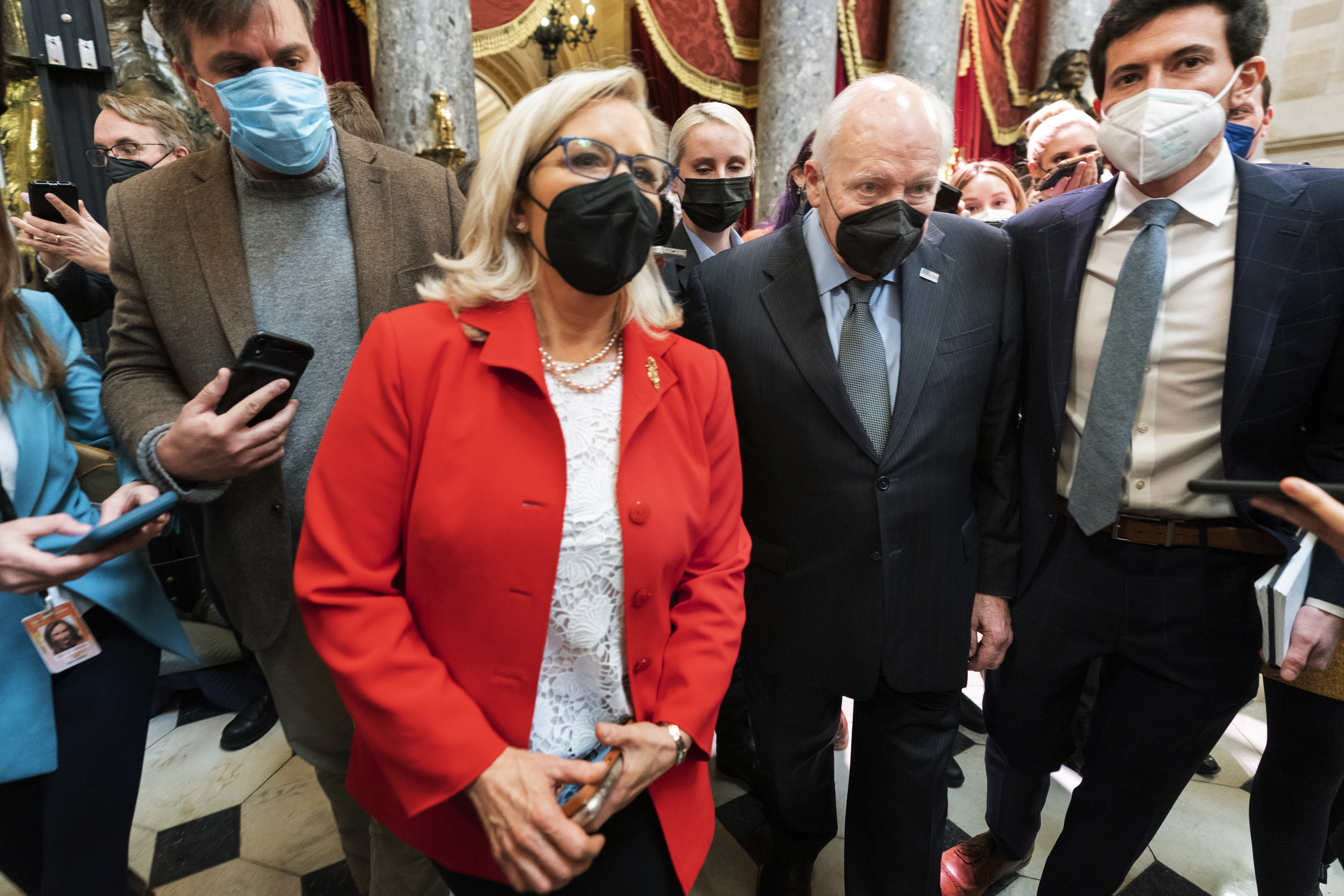 Rep. Liz Cheney, R-Wyo., vice chair of the House panel investigating the Jan. 6 U.S. Capitol insurrection, and her father, former Vice President Dick Cheney walk in the Capitol Rotunda at the Capitol in Washington, Jan. 6. Republican officials meeting in Utah advanced a resolution Thursday that would formally censure Cheney and Rep. Adam Kinzinger.