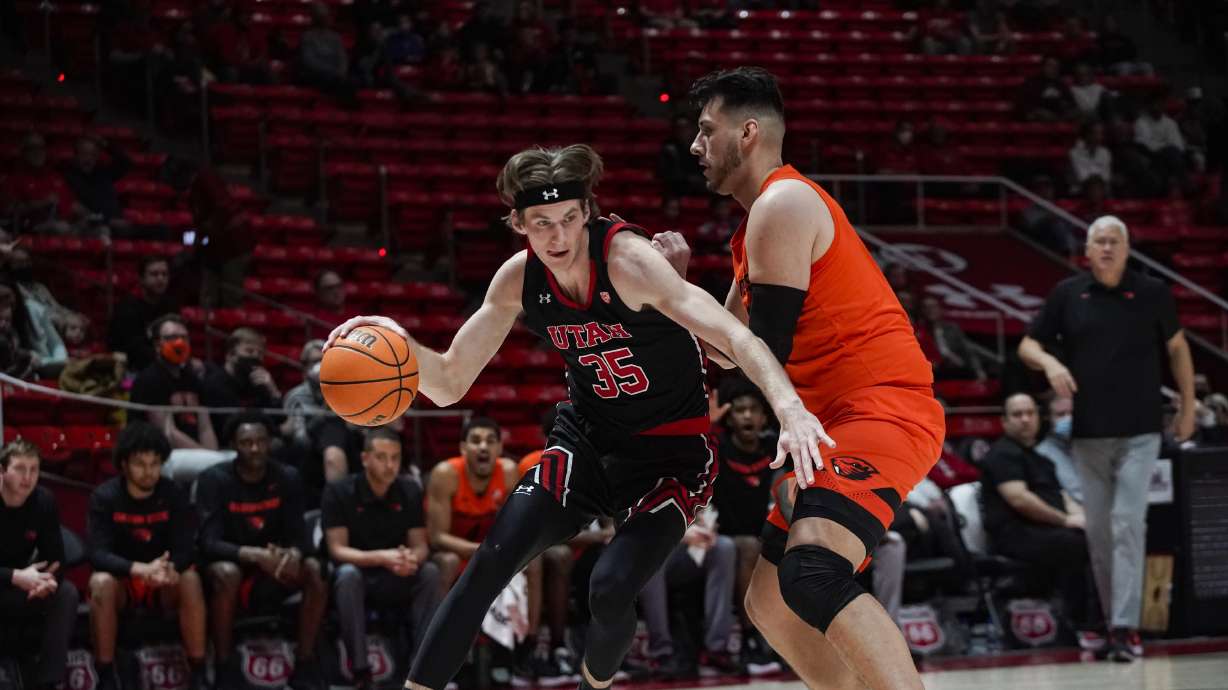 Oregon State Beavers center Roman Silva (12) defends Utah Utes center Branden Carlson (35) as Utah and Oregon State play in Pac-12 basketball action at the Huntsman Center in Salt Lake City on Thursday, Feb. 3, 2022.