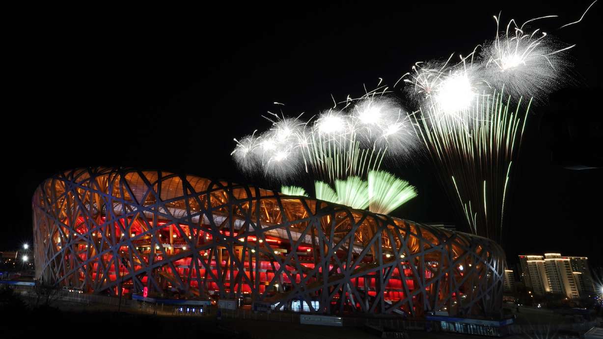 Fireworks explode over the National Stadium during the opening ceremony of the 2022 Winter Olympics, Friday, in Beijing.