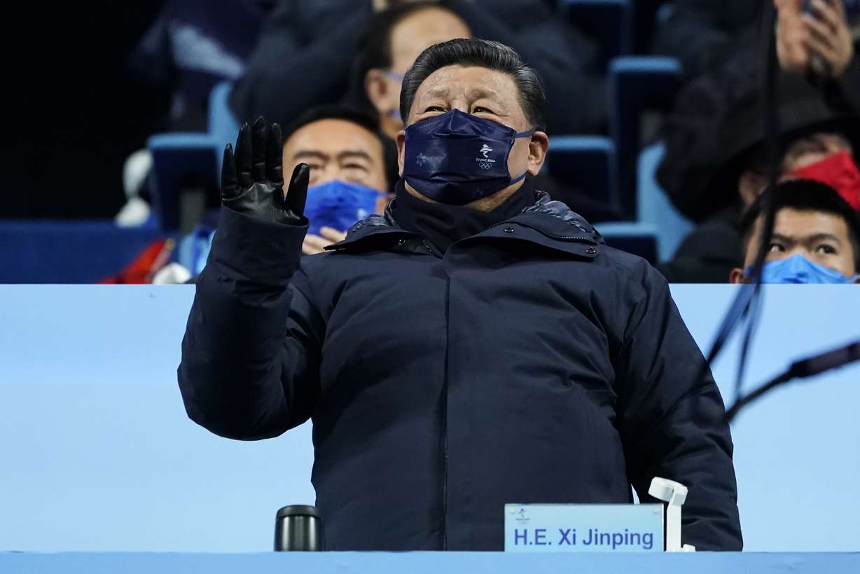 Chinese President Xi Jinping waves during the opening ceremony of the 2022 Winter Olympics, Friday in Beijing.