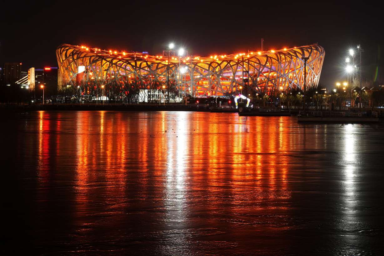 The Olympic Stadium is lit prior to the opening ceremony of the 2022 Winter Olympics, Friday in Beijing.