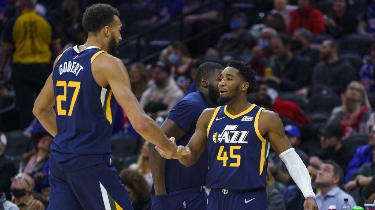 Utah Jazz's Donovan Mitchell, right, celebrates with Rudy Gobert during the second half of the team's NBA basketball game against the Philadelphia 76ers, Thursday, Dec. 9, 2021, in Philadelphia. The All-Star duo's relationship is once again in the news.