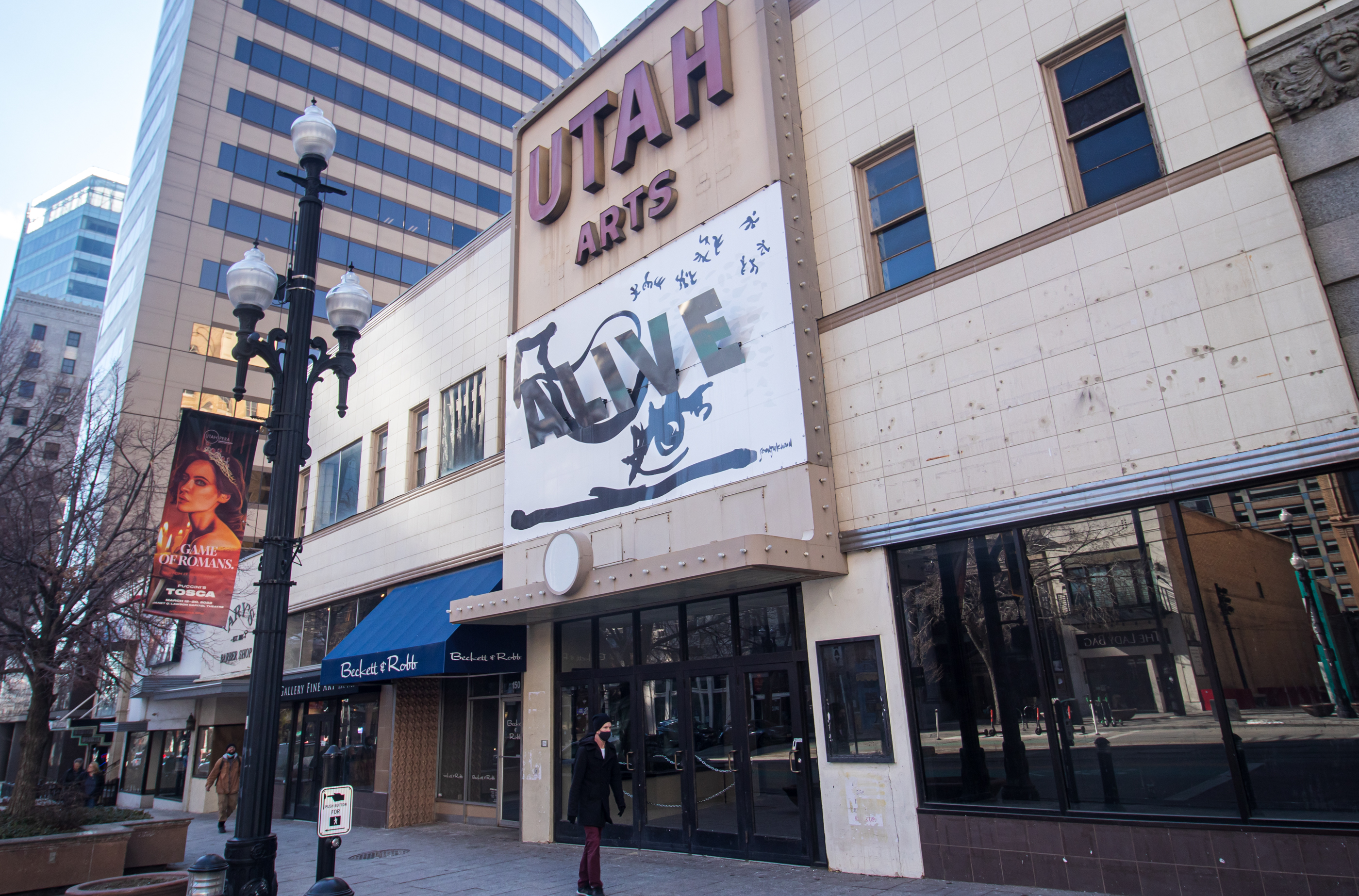 People walk past the exterior of the Utah Pantages Theater entrance on Main Street in Salt Lake City Friday. The company that formally acquired the property last year filed demolition permits last week.