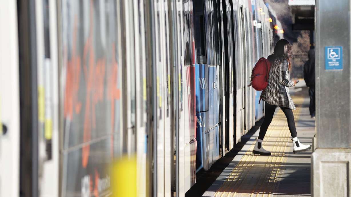 A TRAX rider exits a train in Salt Lake City on Feb. 1, 2022. Utah Transit Authority will not collect fares this weekend as it updates its systemwide collection system.