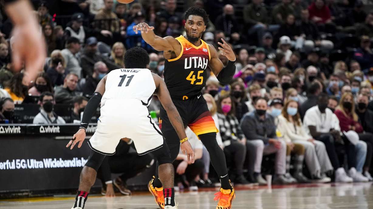 Utah Jazz guard Donovan Mitchell (45) passes a ball during an NBA basketball game at Vivint Arena in Salt Lake City on Friday, Feb. 4, 2022.