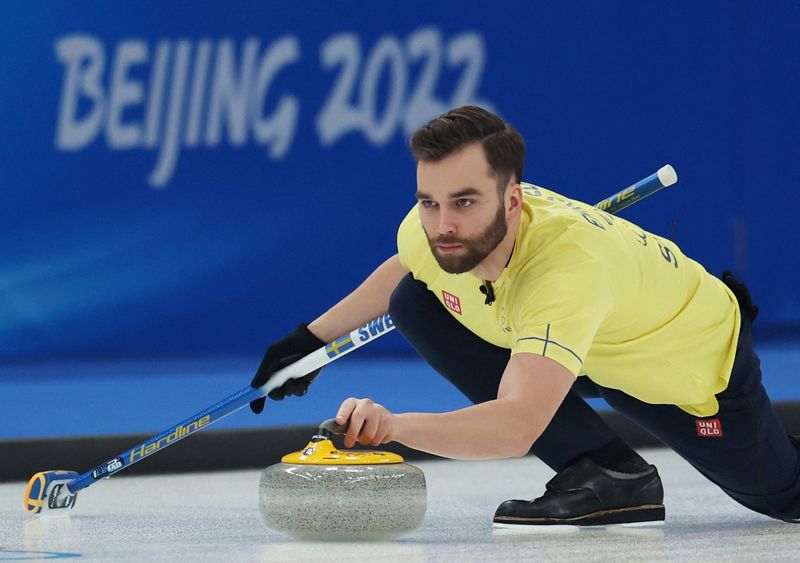2022 Beijing Olympics - Curling - Mixed Doubles Round Robin Session 7 - Switzerland v Sweden - National Aquatics Center, Beijing, China - February 5, 2022. Oskar Eriksson of Sweden in action.