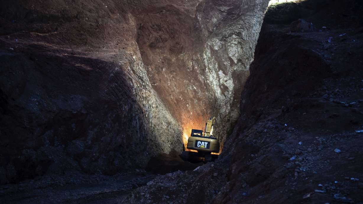 A tractor digs through a mountain during the rescue mission of a boy who fell into a hole in the northern village of Ighran, in Morocco's Chefchaouen province, Friday.