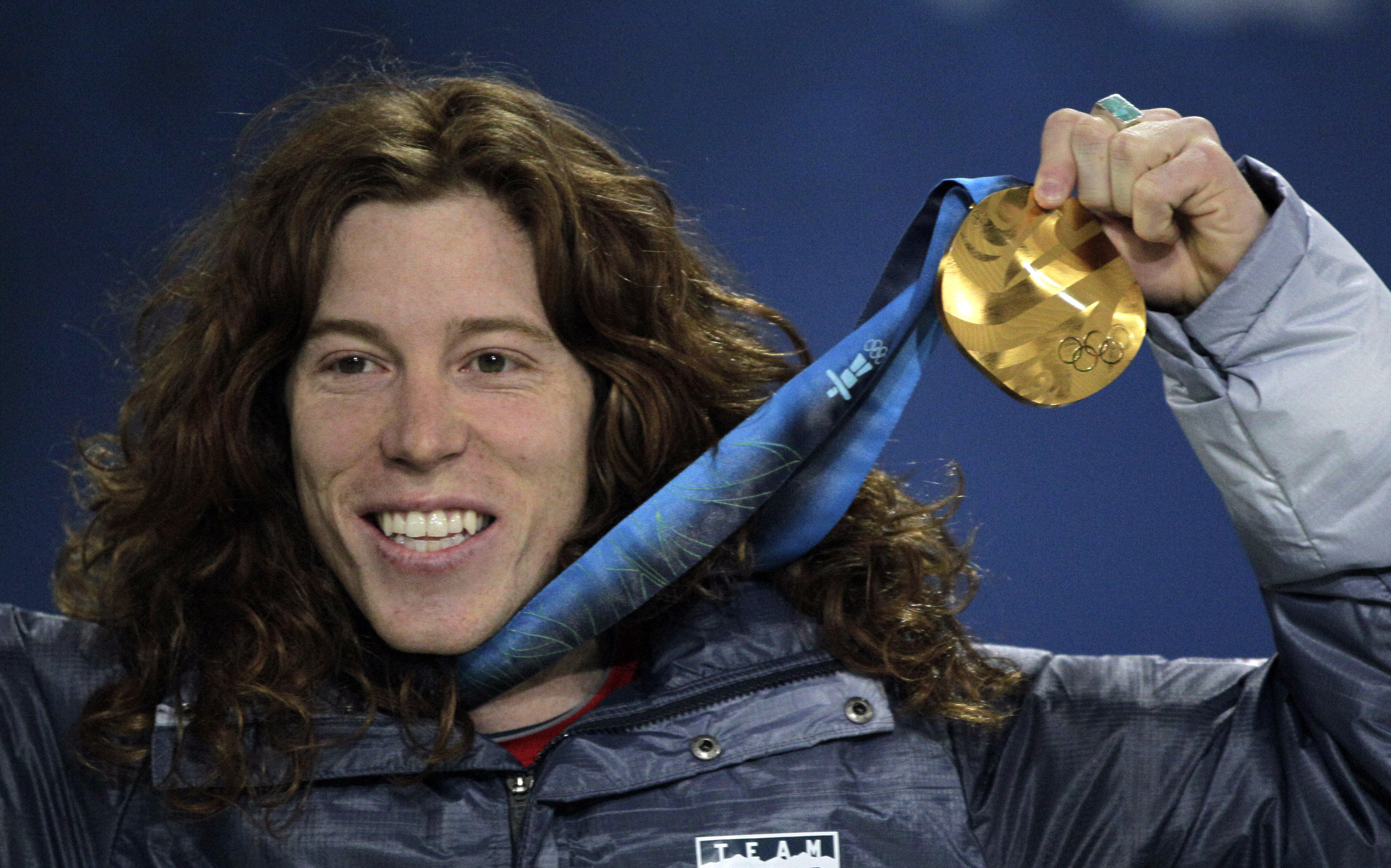 United States' gold medalist Shaun White reacts during the men's halfpipe medal ceremony at the Vancouver 2010 Olympics in Vancouver, British Columbia, Thursday, Feb. 18, 2010.