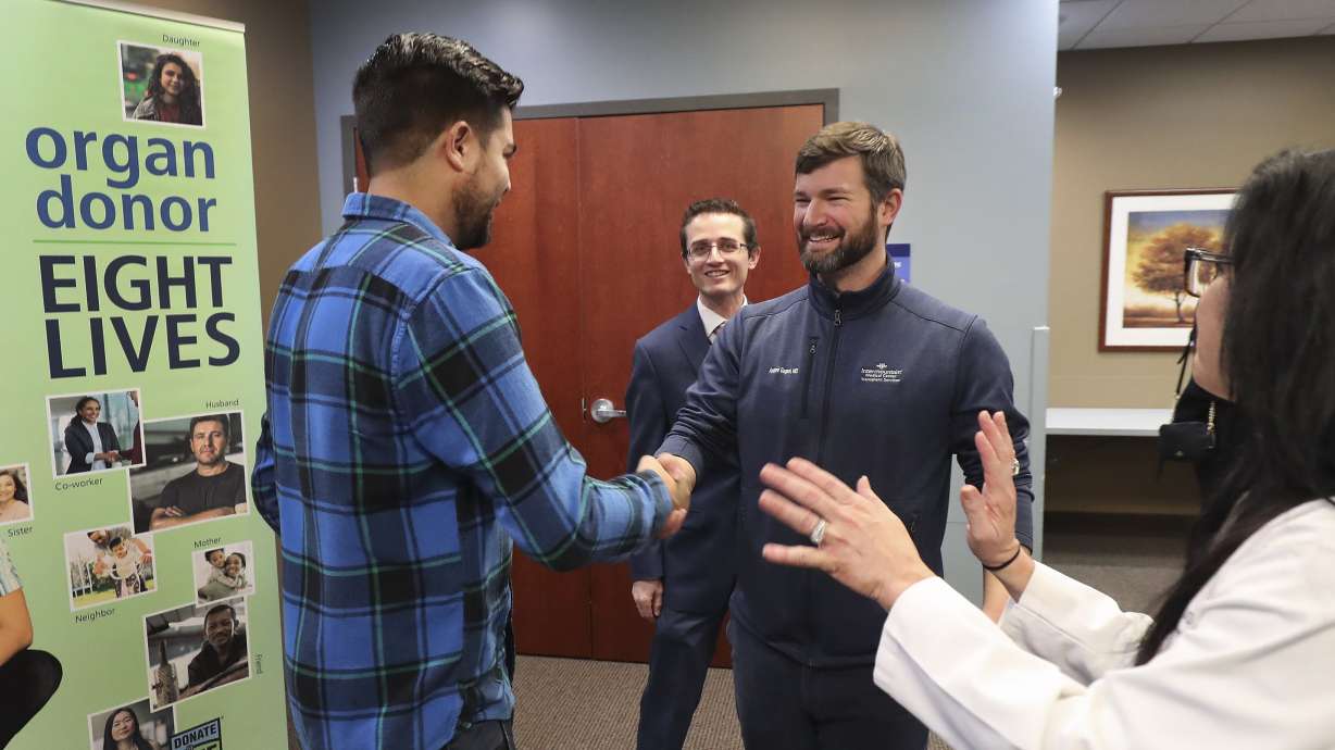 Jeff Willis, left, the 3,000th kidney transplant recipient at Intermountain Medical Center, shakes hands with his surgeon, Dr. Andrew Gagnon, during a celebration with physicians, caregivers, other transplant patients and family members at the Murray facility on Jan. 31, 2020.