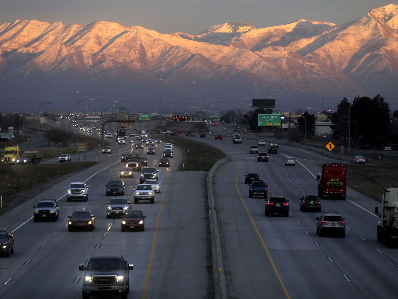 Traffic moves along state Route 201 during rush hour in Salt Lake City on Monday, Jan. 24.