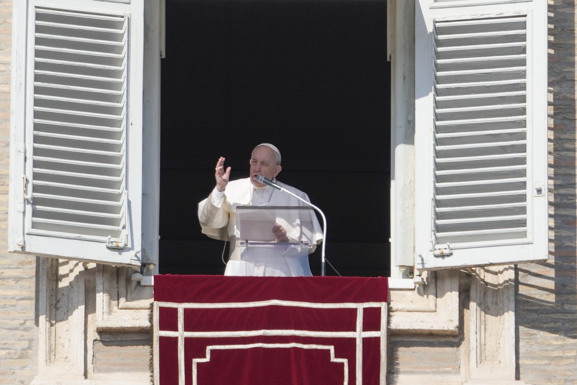 Pope Francis delivers the Angelus noon prayer from his studio window overlooking St. Peter's Square at the Vatican, on Sunday. 