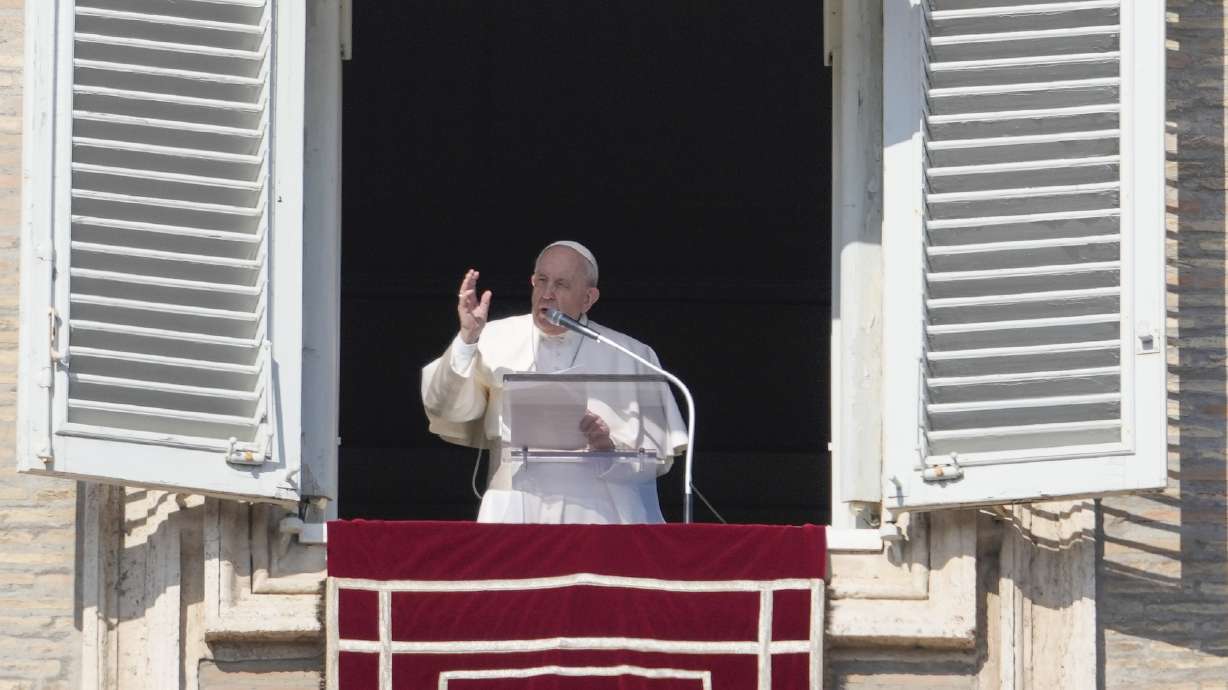 Pope Francis delivers the Angelus noon prayer from his studio window overlooking St. Peter's Square at the Vatican, on Sunday.