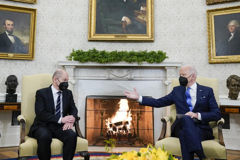 President Joe Biden meets with German Chancellor Olaf Scholz in the Oval Office of the White House, Monday.