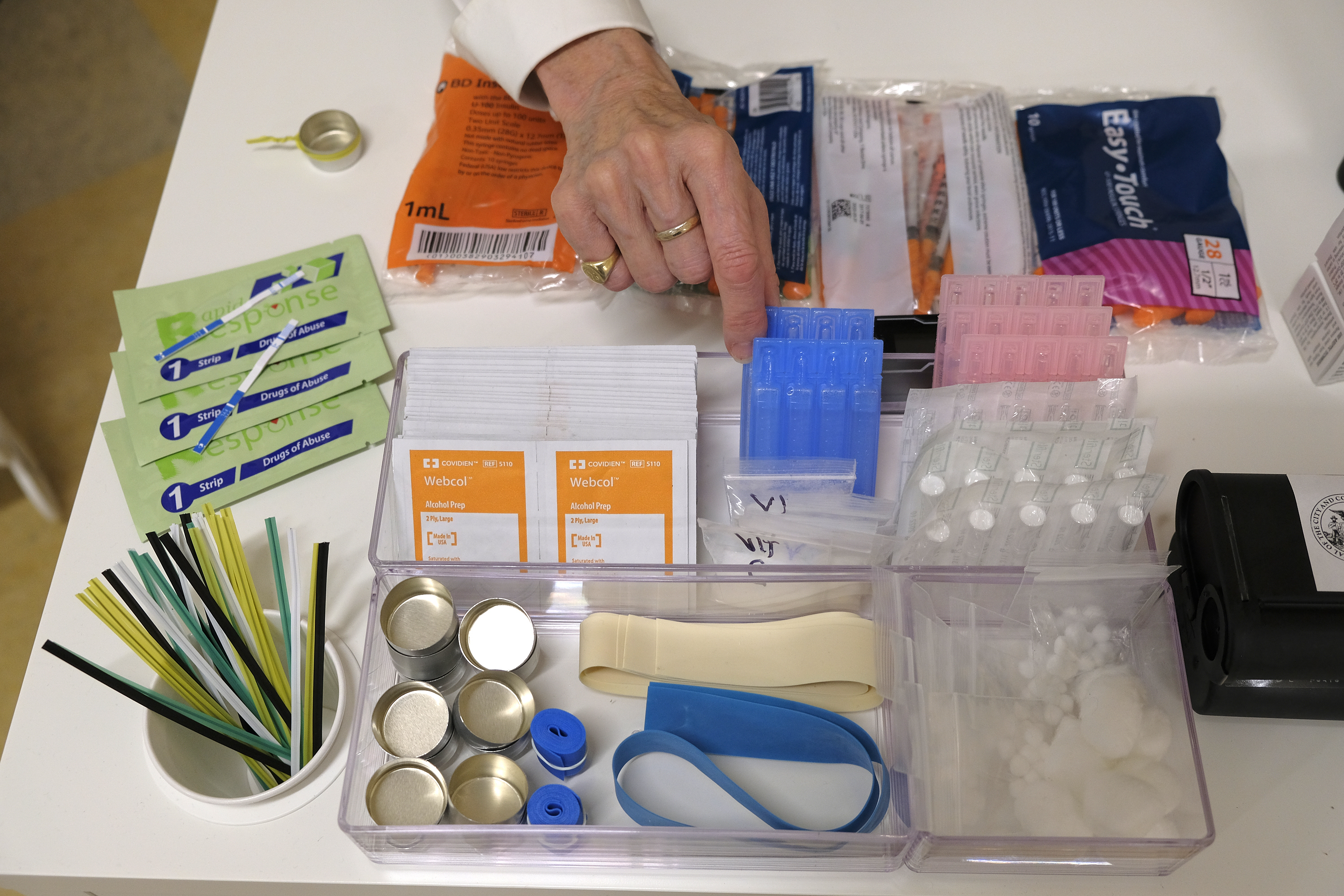 Supplies are shown on a desk at Safer Inside, a realistic model of a safe injection site in San Francisco on Aug. 29, 2018. The Justice Department is signaling it might be open to allowing so-called safe injection sites, or safe havens for people to use heroin and other narcotics with protections against fatal overdoses.