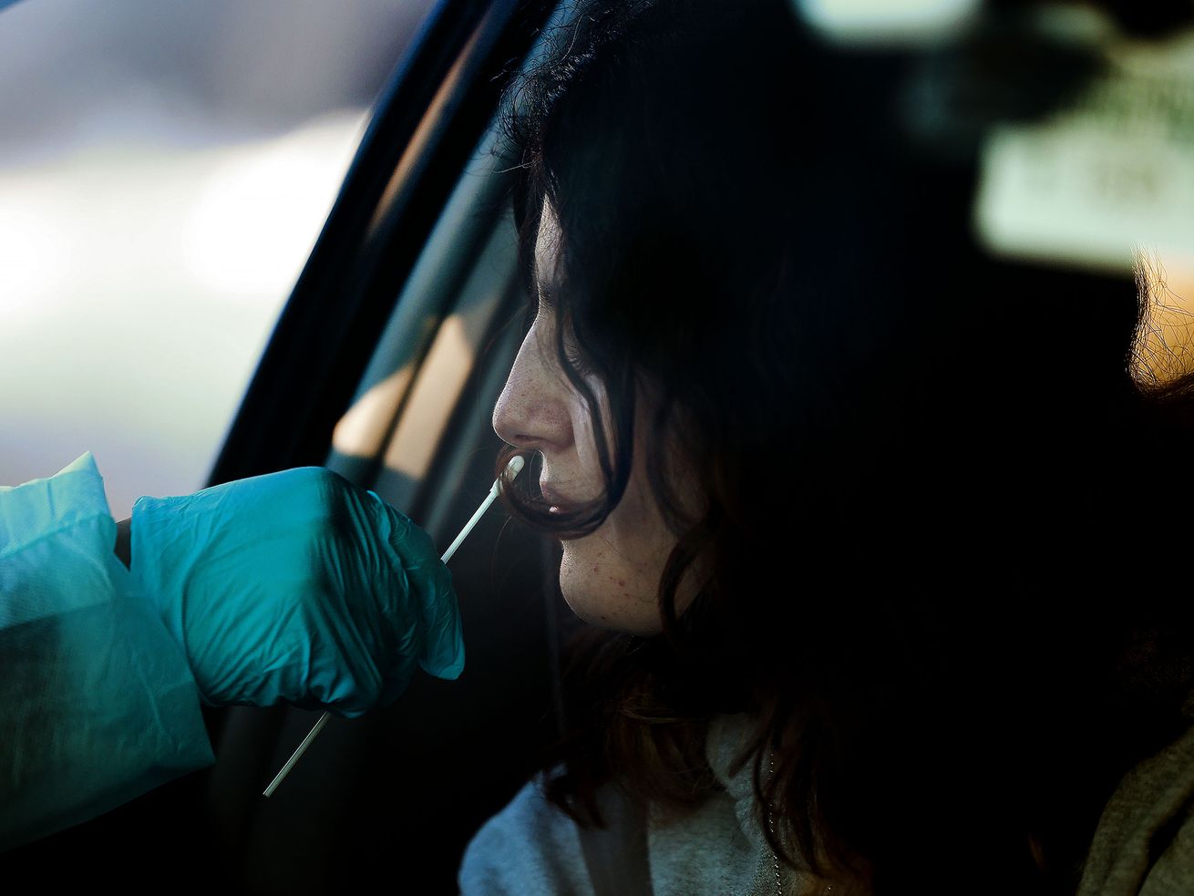 Emilia Lewis, 17, gets a COVID-19 test at the Cannon Health Building in Salt Lake City on Dec. 15, 2021. The pause on rapid COVID-19 tests conducted by the Utah Department of Health could turn out to be permanent.