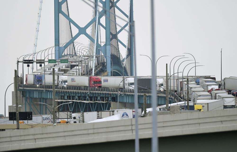 Trucks are backed up heading to and from Canada on the Ambassador Bridge, due to protests on the Windsor side, in Detroit on Monday.
