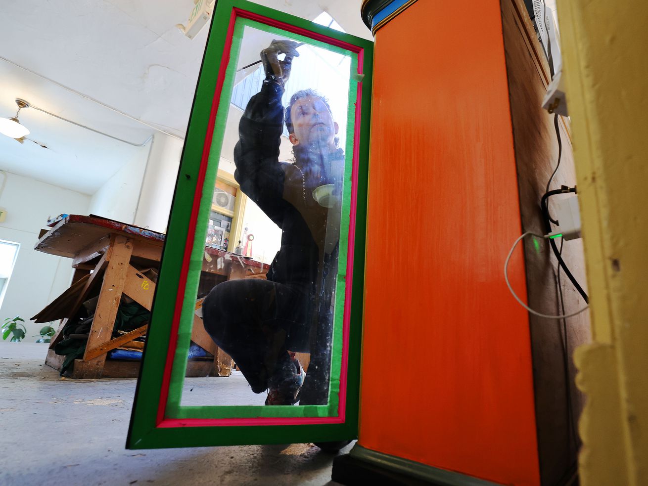 Jason Dickerson, a multimedia artist, works on his Furniture 4 Clowns project at the historic Guthrie Building in Salt Lake City on Feb. 4.