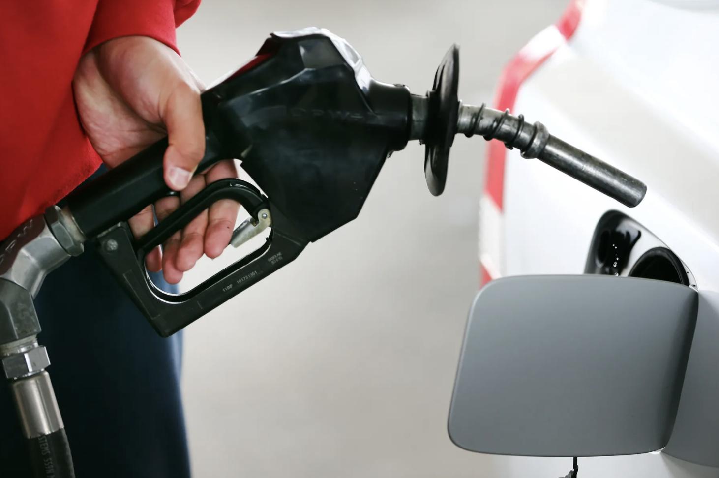 Nifai Tonga removes the nozzle from her vehicle after pumping gasoline at Harts Gas & Food in Midvale on March 24, 2021. Utahns are concerned about inflation, a new poll reveals.