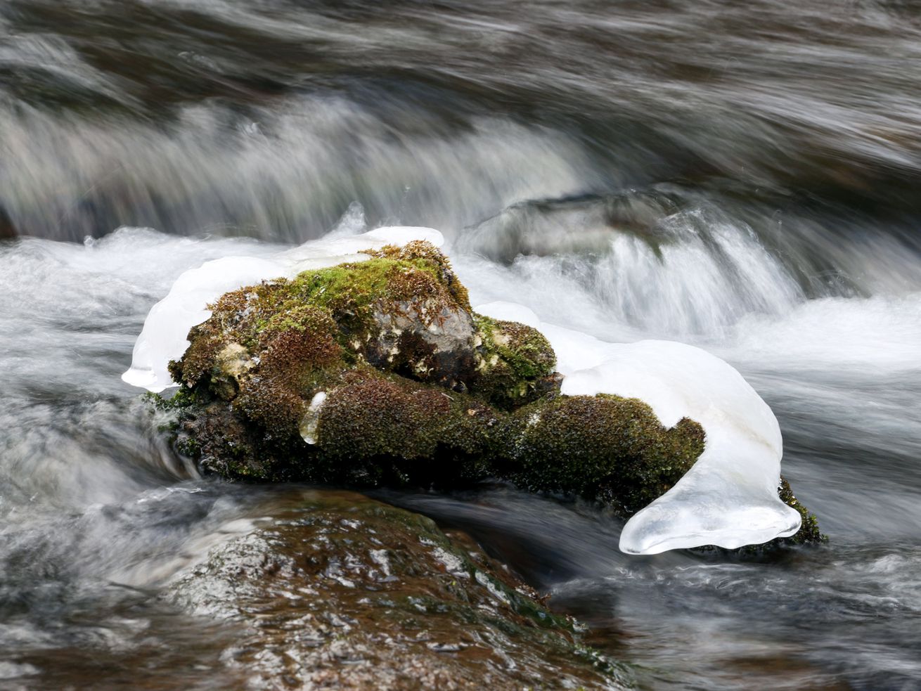 Water runs out of Tibble Fork Reservoir in American Fork Canyon on Feb. 1. The Utah Legislature has buckets and buckets of water bills for consideration.