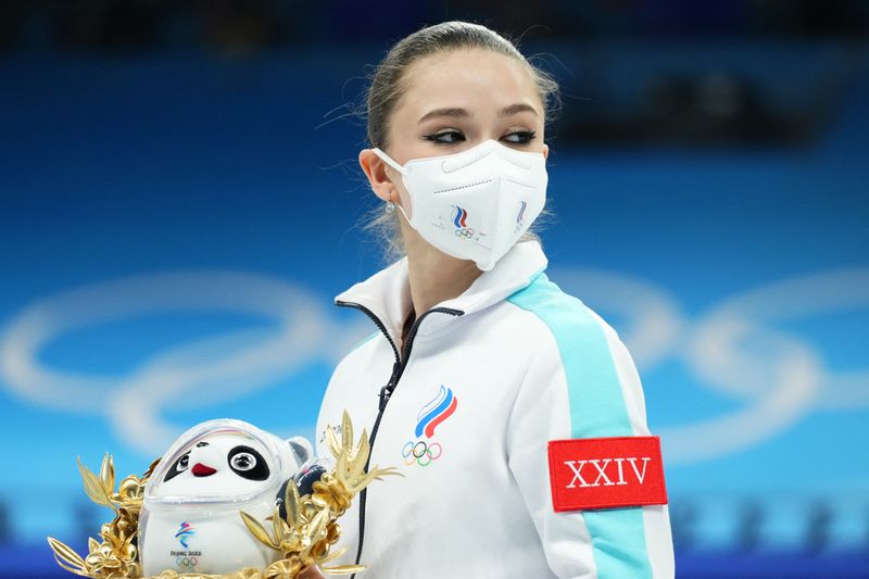 FILE PHOTO: 2022 Beijing Olympics - Figure Skating - Team Event - Women Single Skating - Free Skating - Capital Indoor Stadium, Beijing, China - February 7, 2022. Kamila Valieva of the Russian Olympic Committee after winning gold during the flower ceremony.