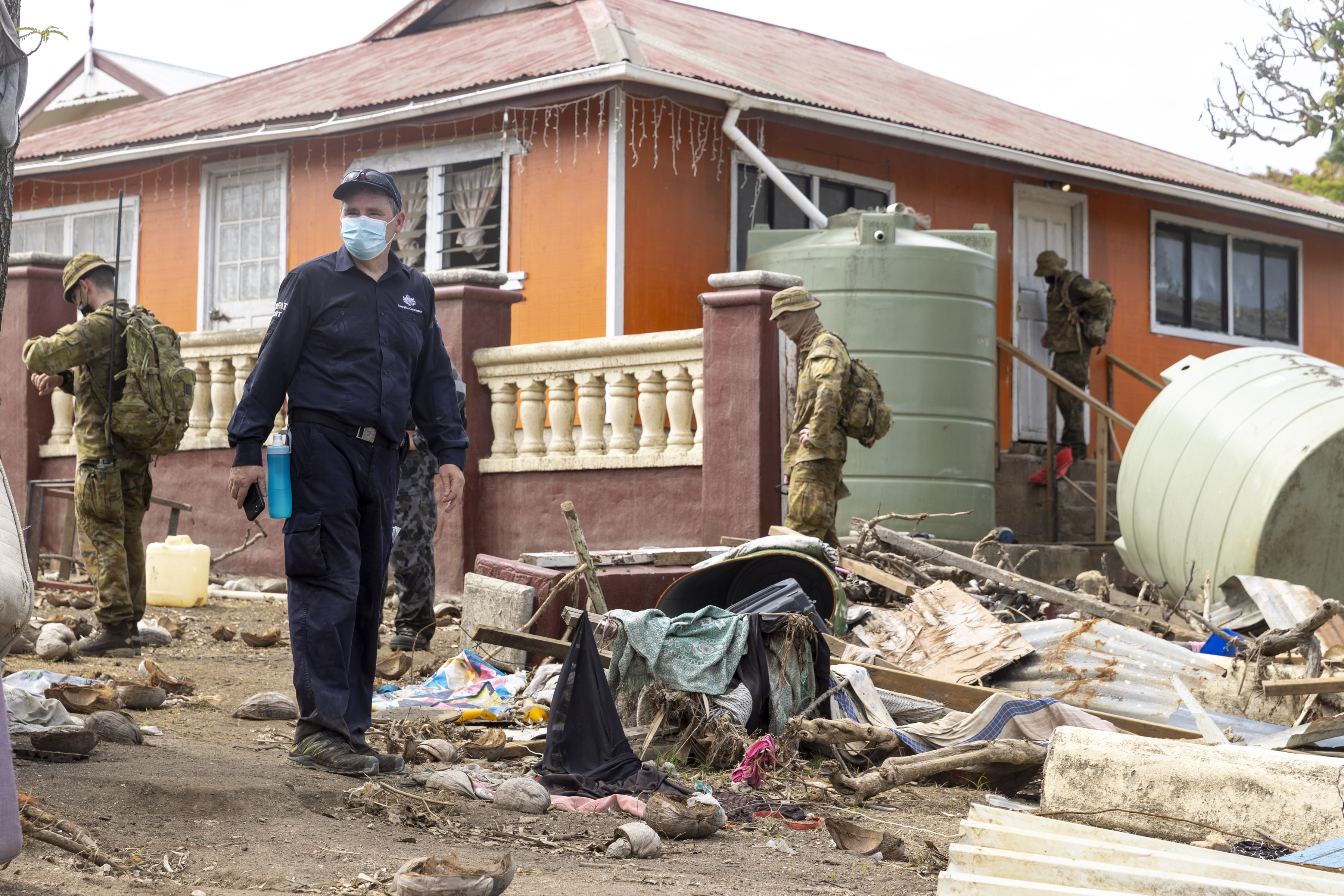 Australian crisis response team personnel make a damage assessment operation in Nuku'alofa, on Atata island in Tonga, following the eruption of an underwater volcano on Friday.