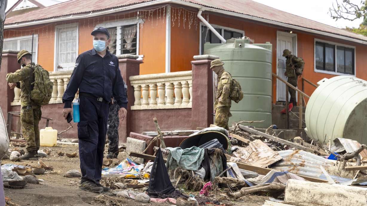 Australian crisis response team personnel make a damage assessment operation in Nuku'alofa, on Atata island in Tonga, following the eruption of an underwater volcano on Friday.